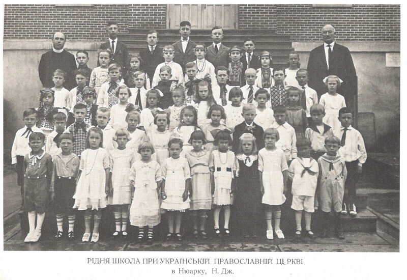 Photograph is undated, but likely 1948. The term used in the caption is "Ridnia Shkola", which literally translates as "Native School", a common term for educational activities, typically on Saturdays, that included Ukrainian language, literature, history, geography, and similar topics.